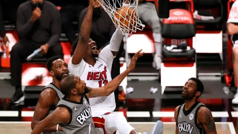 Bam Adebayo scoring over Kevin Durant and Kyrie Irving. (Getty)