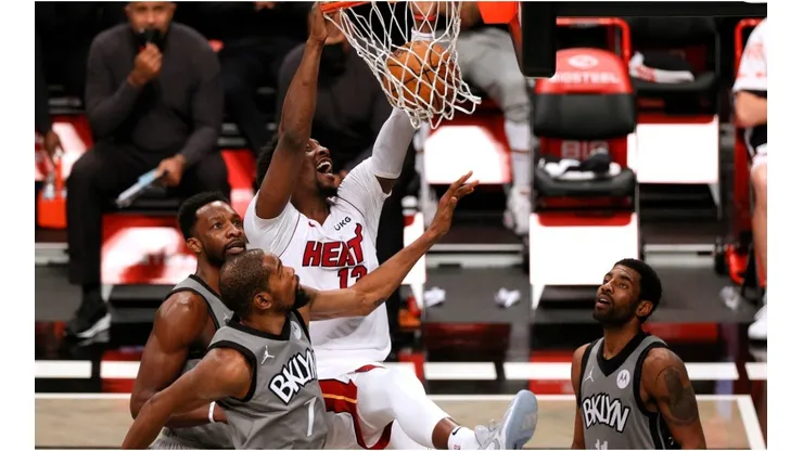 Bam Adebayo scoring over Kevin Durant and Kyrie Irving. (Getty)