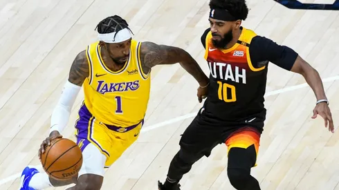Kentavious Caldwell-Pope (left) of the Los Angeles Lakers drives into Mike Conley (right) of the Utah Jazz. (Getty)