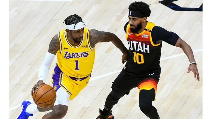 Kentavious Caldwell-Pope (left) of the Los Angeles Lakers drives into Mike Conley (right) of the Utah Jazz. (Getty)
