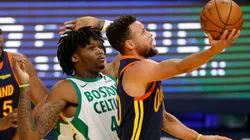 Stephen Curry scores over Robert Williams III. (Getty)