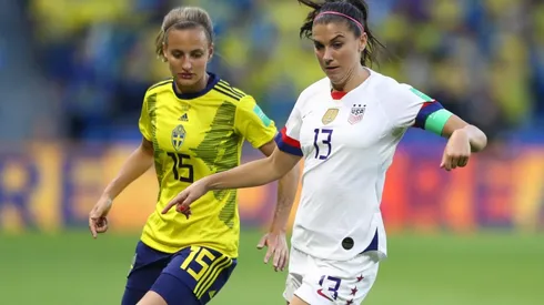 Alex Morgan of the USA (right) battles for possession with Nathalie Bjorn of Sweden (left).