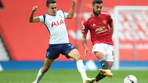 Sergio Reguilon (left) of Tottenham Hotspur battles for possession with Bruno Fernandes (right) of Manchester United.