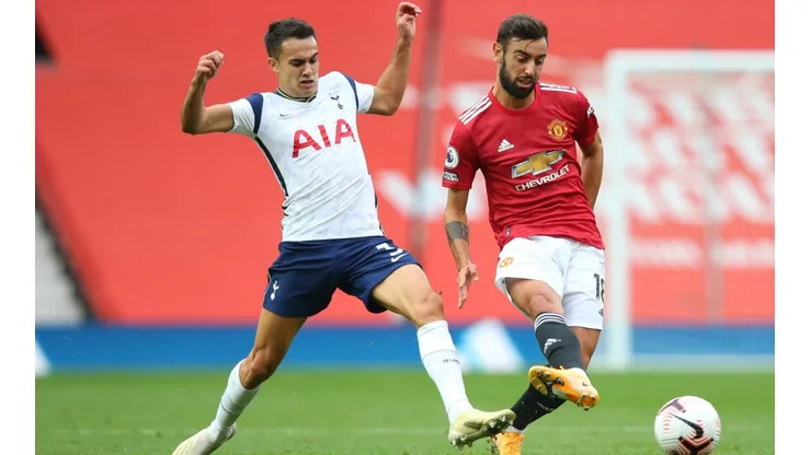 Sergio Reguilon (left) of Tottenham Hotspur battles for possession with Bruno Fernandes (right) of Manchester United.