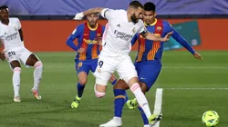 Karim Benzema (centre) of Real Madrid scores a goal vs Barcelona.