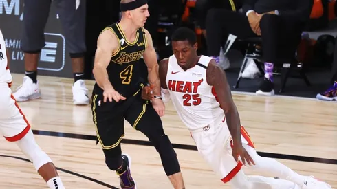 Kendrick Nunn (right) of the Miami Heat drives the ball against Alex Caruso (left) of the Los Angeles Lakers.