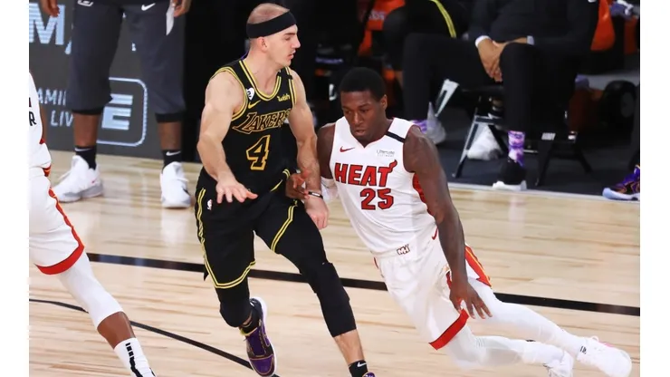 Kendrick Nunn (right) of the Miami Heat drives the ball against Alex Caruso (left) of the Los Angeles Lakers.