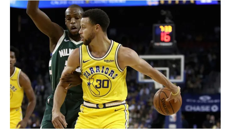 Stephen Curry & Khris Middleton. (Getty)