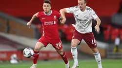 Diogo Jota of Liverpool (left) is challenged by Rob Holding of Arsenal (right).
