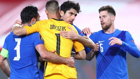 Players of Greece celebrate after the qualifying match against Spain.