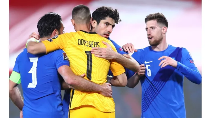 Players of Greece celebrate after the qualifying match against Spain.