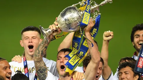 Leeds United players lift the 2019-20 EFL Championship trophy.