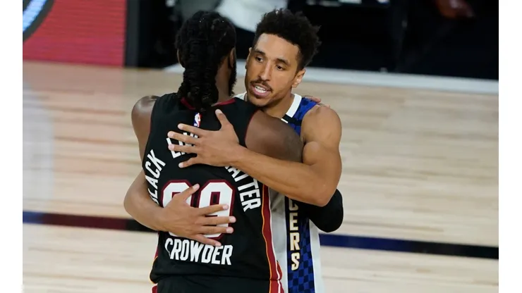 Jae Crowder (left) of the Miami Heat embraces Malcolm Brogdon (right) of the Indiana Pacers