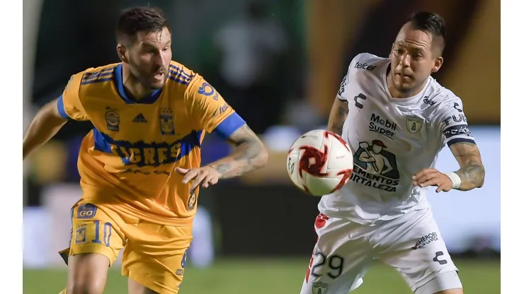 Andre-Pierre Gignac (left) of Tigres fights for the ball with Rodrigo Salinas (right) of Pachuca. (Getty)