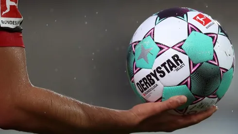 Bayer Leverkusen player holds the official Derbystar match ball during the 2020-21 Bundesliga. (Getty).jpg