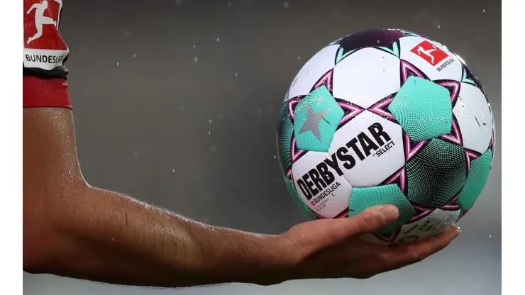 Bayer Leverkusen player holds the official Derbystar match ball during the 2020-21 Bundesliga. (Getty).jpg