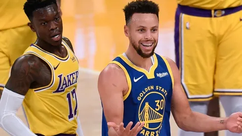 Stephen Curry (right) of the Golden State Warriors reacts after a foul on Dennis Schroder (left) of the Los Angeles Lakers. (Getty)