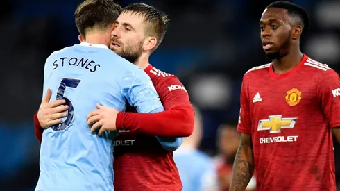 Luke Shaw of Manchester United (centre) interacts with John Stones of Manchester City (left). (Getty)
