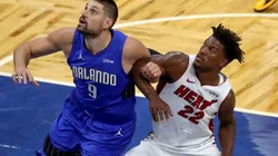 Nikola Vucevic (left) of the Orlando Magic and Jimmy Butler (right) of the Miami Heat. (Getty)