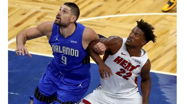 Nikola Vucevic (left) of the Orlando Magic and Jimmy Butler (right) of the Miami Heat. (Getty)