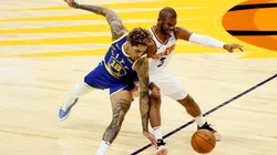Chris Paul (right) of the Phoenix Suns and Kelly Oubre Jr. (left) of the Golden State Warriors. (Getty)