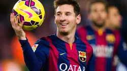 Lionel Messi of Barcelona with the match ball after scoring a hat-trick vs Espanyol in 2014. (Getty)