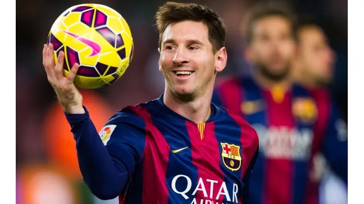 Lionel Messi of Barcelona with the match ball after scoring a hat-trick vs Espanyol in 2014. (Getty)