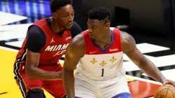 Zion Williamson (right) of the New Orleans Pelicans is defended by Bam Adebayo (left) of the Miami Heat. (Getty)