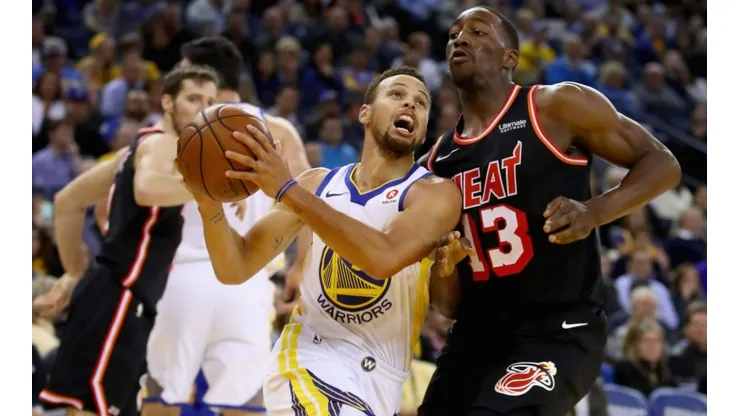 Stephen Curry vs. Bam Adebayo. (Getty)
