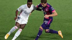 Vinicius Junior of Real Madrid (left) is challenged by Pablo Hervias of Real Valladolid (right). (Getty)