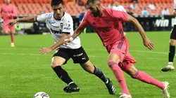Karim Benzema (right) of Real Madrid takes on Toni Lato of Valencia (left). (Getty)