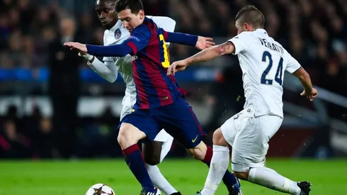 Lionel Messi getting past Marco Verrati. (Getty)