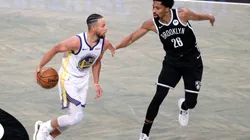 Stephen Curry (left) of the Golden State Warriors dribbles against Spencer Dinwiddie (right) of the Brooklyn Nets. (Getty)