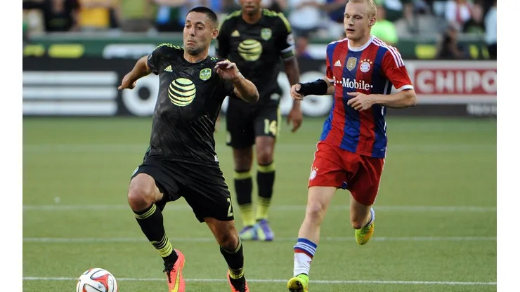 Clint Dempsey (left) of the MLS All-Stars brings the ball up the pitch on Bayern Munich (Getty).