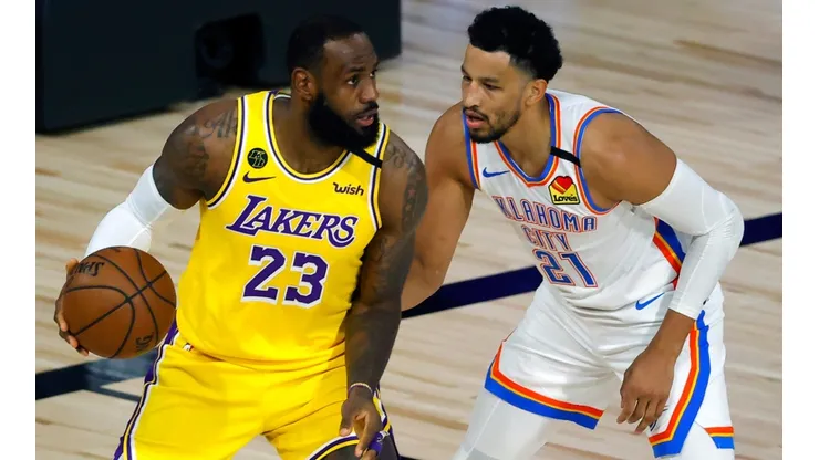 LeBron James (left) of the Los Angeles Lakers is defended by Andre Roberson (right) of the Oklahoma City Thunder. (Getty)