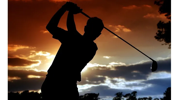Luke Donald of England hits a tee shot on the 15th hole during the third round of The Masters