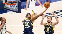 Myles Turner #33 of the Indiana Pacers reaches for the ball after Rudy Gobert #27 of the Utah Jazz misses the shot . (Getty)