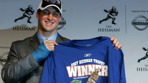 Tim Tebow of the University of Florida holds up a winners shirt after winning the 73rd Annual Heisman Memorial Trophy in 2007. (Getty)