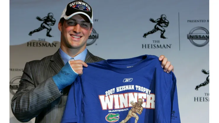Tim Tebow of the University of Florida holds up a winners shirt after winning the 73rd Annual Heisman Memorial Trophy in 2007. (Getty)