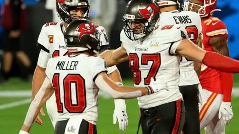 Rob Gronkowski #87 of the Tampa Bay Buccaneers reacts after scoring a 17 yard touchdown with Tom Brady #12 and Scott Miller #10 in the second quarter against the Kansas City Chiefs in Super Bowl LV (Getty).