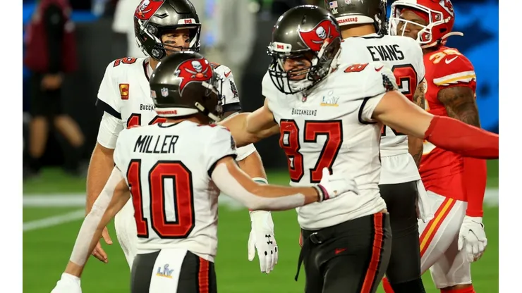 Rob Gronkowski #87 of the Tampa Bay Buccaneers reacts after scoring a 17 yard touchdown with Tom Brady #12 and Scott Miller #10 in the second quarter against the Kansas City Chiefs in Super Bowl LV (Getty).