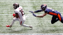 Brandon Powell (left) of the Atlanta Falcons scores a receiving touchdown against Justin Simmons (right) of the Denver Broncos. (Getty)
