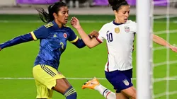 Carli Lloyd (right) of the United States shoots the ball against Sandra Sepulveda (left) of Colombia. (Getty)