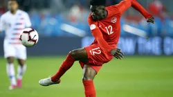Alphonso Davies of Canada has a shot on goal against the United States. (Getty)