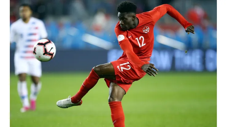 Alphonso Davies of Canada has a shot on goal against the United States. (Getty)
