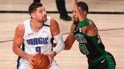 Nikola Vucevic of the Orlando Magic (left) is defended by Jayson Tatum of the Boston Celtics (right). (Getty)