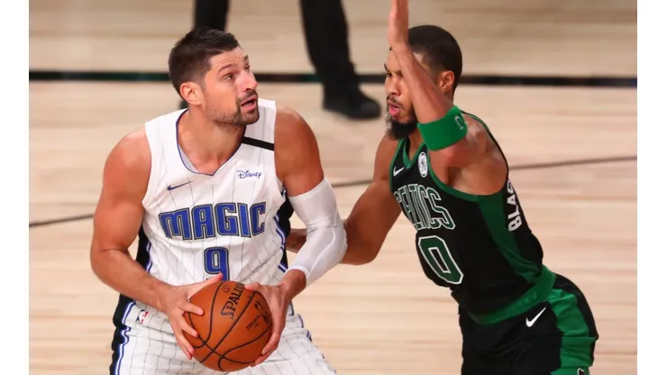 Nikola Vucevic of the Orlando Magic (left) is defended by Jayson Tatum of the Boston Celtics (right). (Getty)