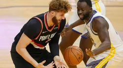 Jusuf Nurkic (left) of the Portland Trail Blazers and Draymond Green (right) of the Golden State Warriors. (Getty)