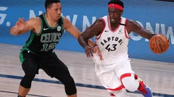 Pascal Siakam (right) of the Toronto Raptors drives the ball against Grant Williams (left) of the Boston Celtics. (Getty)