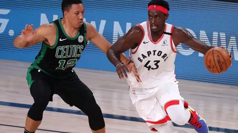 Pascal Siakam (right) of the Toronto Raptors drives the ball against Grant Williams (left) of the Boston Celtics. (Getty)